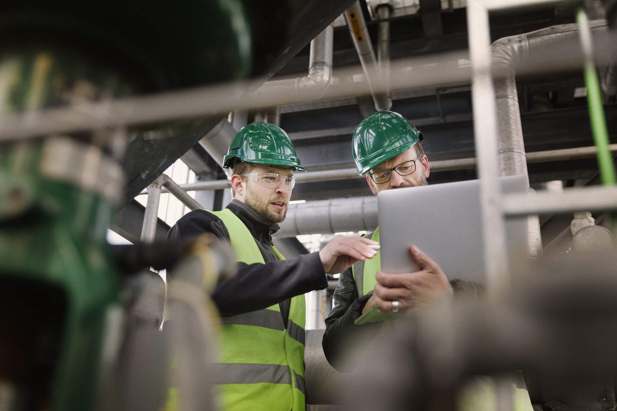 OSHA worker explaining new hazard communication standard to chemical manager